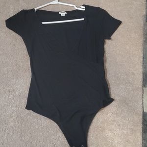 T- shirt style bodysuit with crossover bodice.